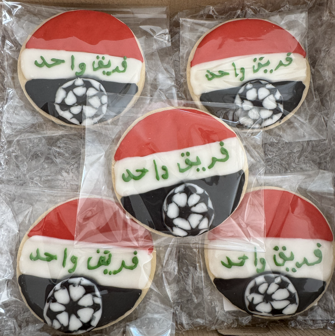 Iraq flag cookies with soccer ball and Arabic lettering