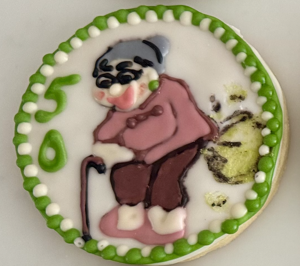Close-up of a 50th birthday cookie with detailed character art
