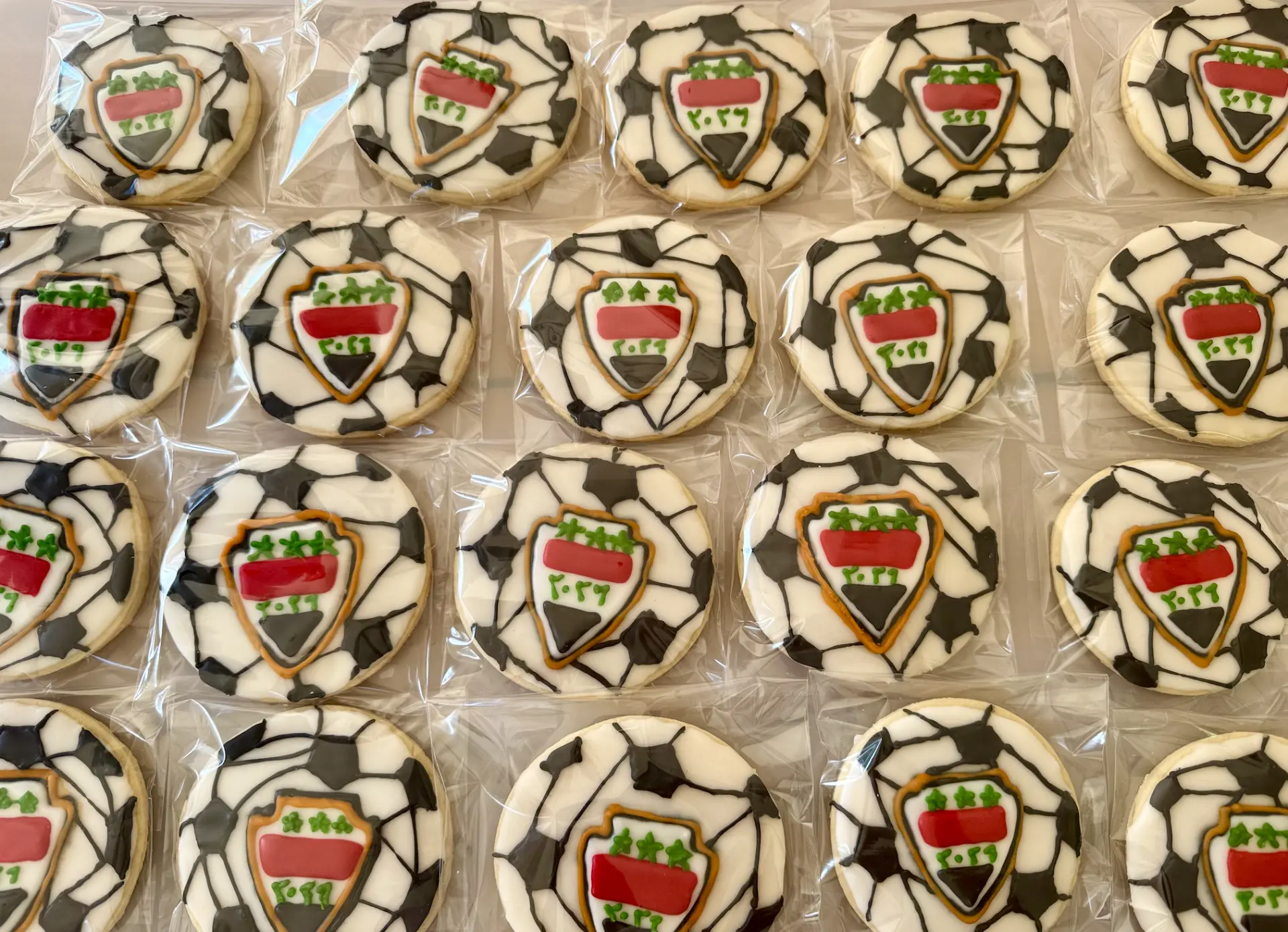 Soccer ball cookies with Iraq crest and 2026 detail, individually wrapped