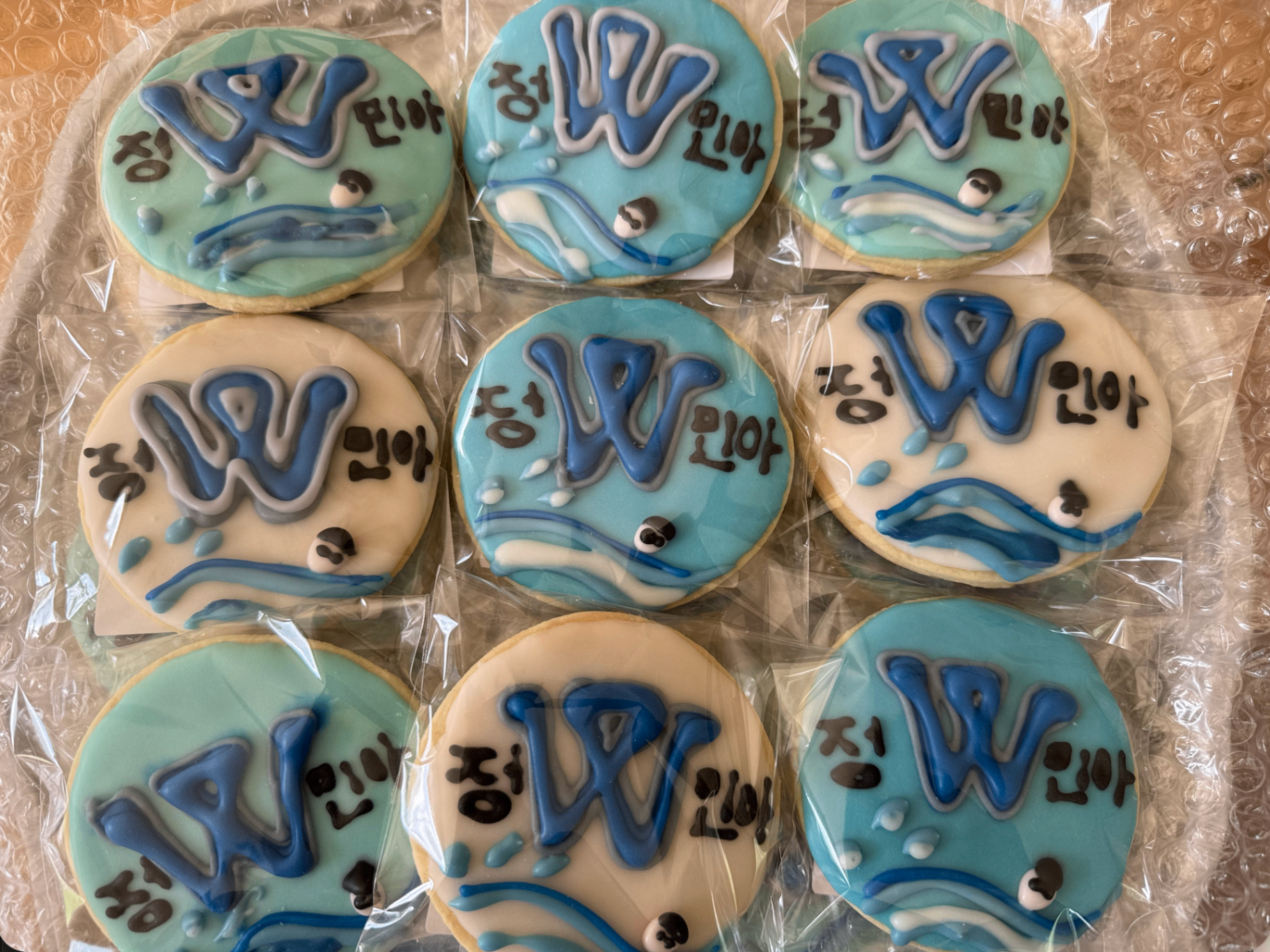 Swim team 'W' cookies with swimmer detail and personalized names