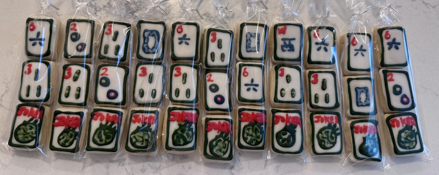 Mahjong tile cookie wrapped with pink and blue ribbon